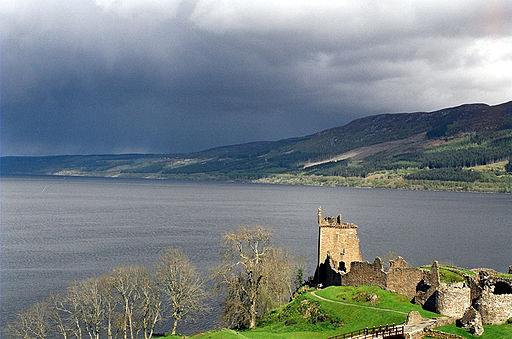 View of Loch Ness, hills, clod, with Urquhart Castle in foreground