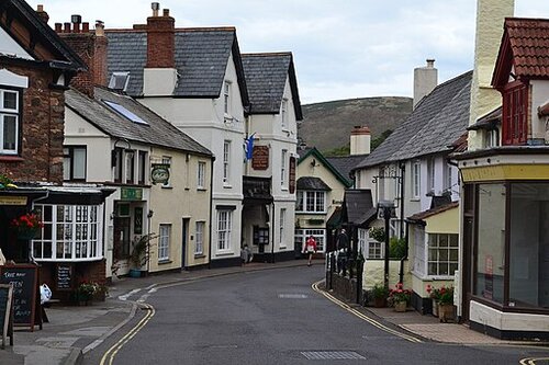 High Street Porlock. Houses each side.