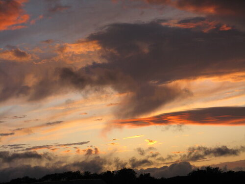 Sunset with red black and yellow clouds